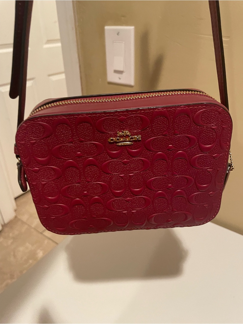 Coach Embossed Signature Crossbody Bag in Dark Red